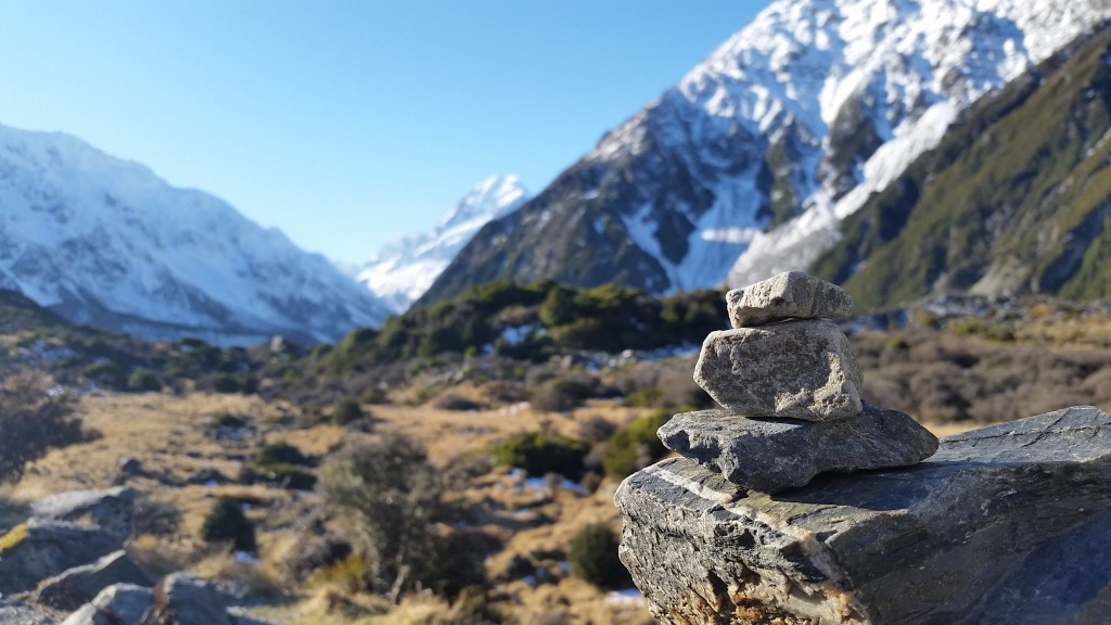 Stacked stone tributes line the edges of the monument, a small gesture from other hikers to those that have fallen. 